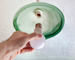 Fire Safety - Install light bulb in fixture - Arizona Total Home Restoration